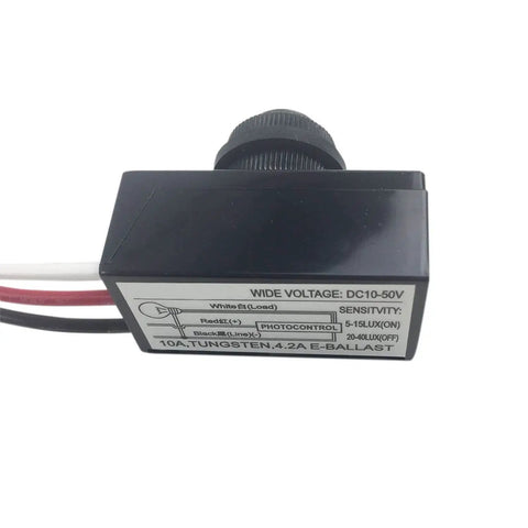 Close-up of 2 Pack DC 8-50V Photoelectric Light Control Switch Dusk To Dawn Sensor showing voltage label