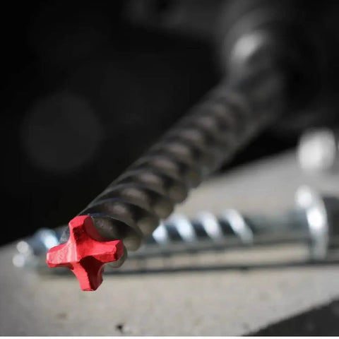 Close-up of Rebar Demon SDS Plus 4 Cutter Full Carbide Head Hammer Drill Bit for concrete, showing red carbide tip.