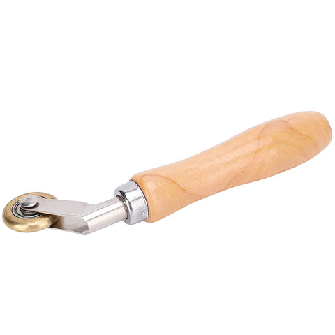 Steel seam roller with wooden handle and brass wheel for roofing membranes and flashing.