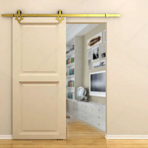 Gold Barn Door Hardware Kit With 72 Inch Adjustable Length On A 6-Foot Track, Diamond Shaped Rollers, installed in living area.
