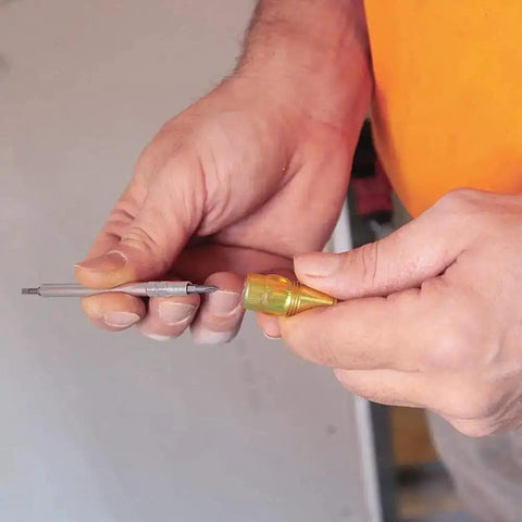 Person holding Four In One Electronics Pocket Screwdriver Set With Phillips And Slotted Bits For DIY Tech Repairs Concealable Tip Pocket