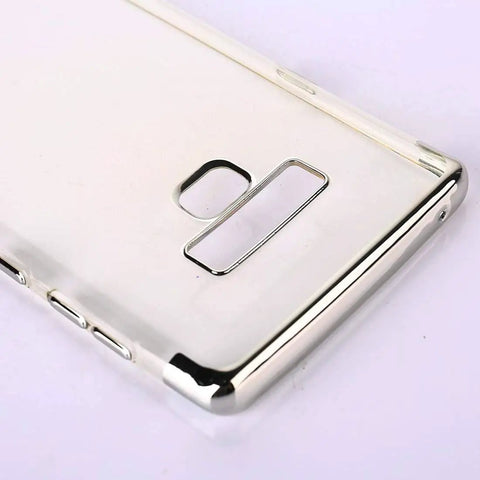 Close-up of a sleek metallic phone case with cutouts for camera and buttons, shown from the back angle with a shiny finish.