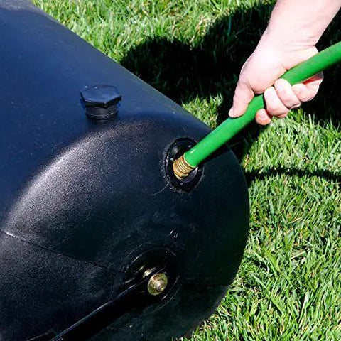 Close-up of a hose filling a Powerful 270 Lb Poly Lawn Roller For Push Or Tow With Easy Turn Tethered Plug And Quick Filling Drum.