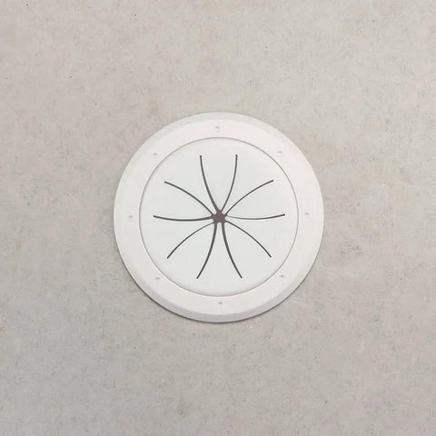 White round 2-inch Spring-Lock cable pass-through port cover, front view; pair included.