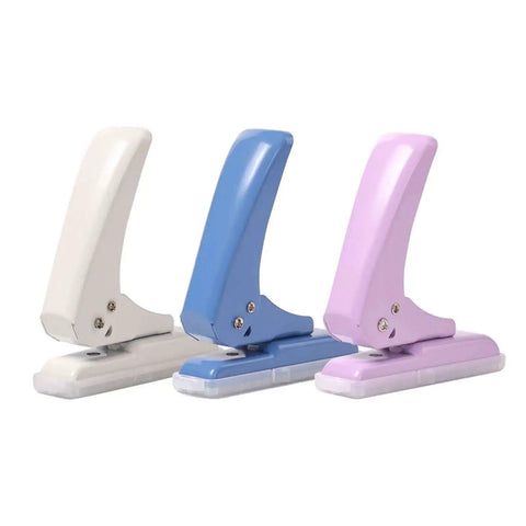 Three Pro Grade 40 Sheet Single Hole Punch With Non Slip Base in pastel colors for chipboard cards and scrapbooks, adjustable punch position.