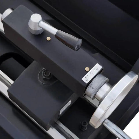 Close-up of the handle and measurement dial of the Industrial Metal Lathe Machine For Home Shop And Workshop With 10.2 Inch Swing And 27.5 Inch Distance Between Centers Geared Head Lathe High Torque Variable Speed Turning 115-1620 RPM AC 110V 1HP By TechTONGDA.