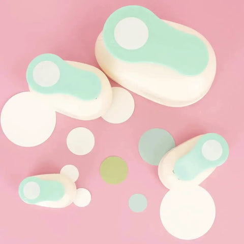 Assorted turquoise 3-inch circle punches with cut paper circles, ideal for scrapbooking and card making. Three Inch Circle Hole Punch With Lever.