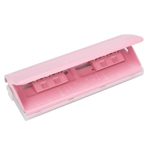 Pink adjustable 6-hole punch with durable metal construction, 6 sheet capacity, non-slip base, ruler guide, fits various planner sizes.