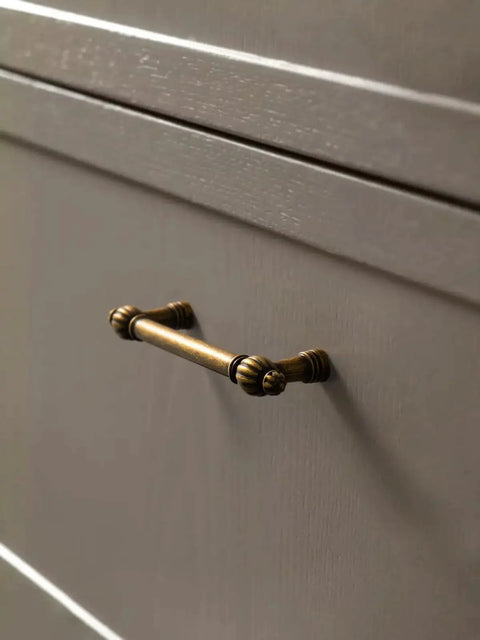 Antique Brass Zinc Alloy Cabinet Pulls Three And Three Quarters Inch Hole Center installed on a kitchen cabinet drawer
