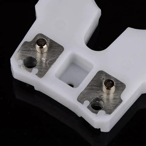 Close-up of Pro Grade Tool Holder Clamp for CNC machines with metal plates, showcasing wear and heat-resistant ABS, focus on clamp details.
