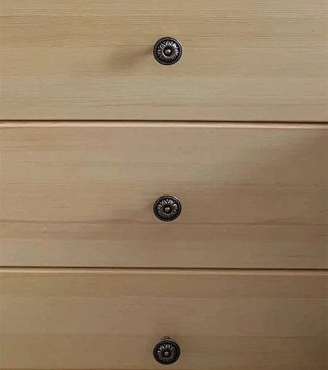Antique Bronze Flower Knob Set for Cabinets and Drawers installed on wooden dresser, showing vintage flower-shaped cabinet hardware pulls.