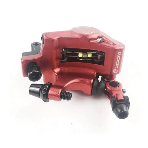 Red ZOOM MTB hydraulic disc brake caliper, aluminum alloy, close-up view for front or rear use