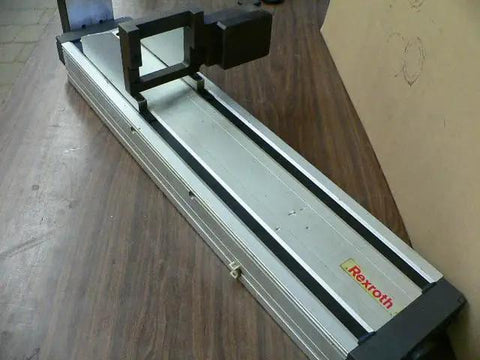 Single Pre-owned Robotic Linear Unit with Precision Automation Guide Rail and Slide Block on table, used motion stage in view