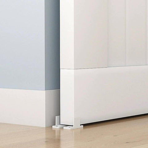 Barn Door Floor Guide for Smooth Sliding Doors installed showing floor-mounted hardware with screws, white finish on wooden floor.