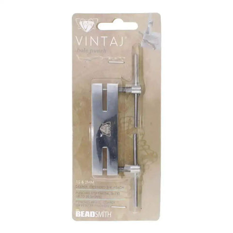 Dual Tip Hole Punch Tool 1.5mm And 2mm in packaging, Vintaj branded, pro-grade metal punch for jewelry making and leather craft projects.