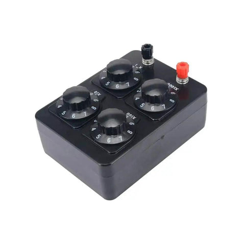 Acxico resistance box with four rotary dials and red/black terminal posts on a black plastic enclosure.