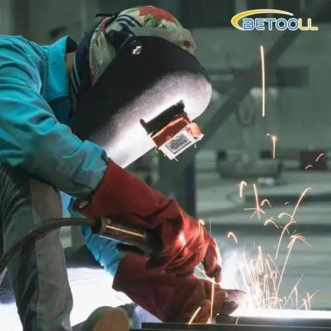 Welder using Argon Regulator For Welding With 6.6Ft Hose And CGA580 Fitting in industrial setting, sparks flying