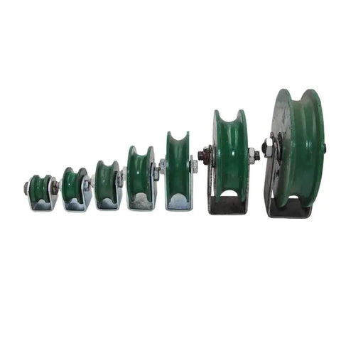 Assorted sizes of green cast iron wheels with U grooves set in increasing order for tracks and sliding doors.