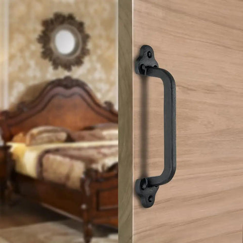 Rustic 9 Inch Cast Iron Sliding Barn Door Handle 2 Pack Black Vintage Gate Pull installed on wooden interior door