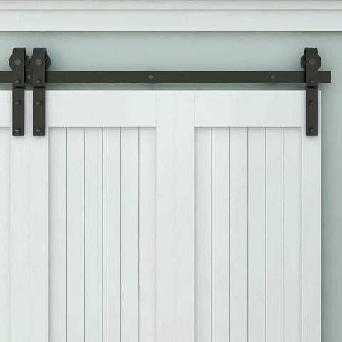 Front view of Heavy Duty Bi Folding Barn Door Hardware Kit For Double Doors, Matte Black track installed on white doors