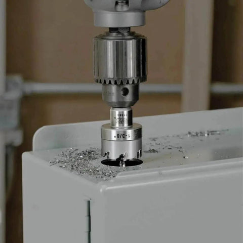 Heavy Duty Beast Carbide Hole Saw Kit With Pilot Bit In Rust Proof Molded Plastic Case Includes Three Hole Saws 7/8 Inch 1-1/8 Inch 1-3/8 Inch Plus One More Size For Quick Precise Drilling In Stainless Steel Mild Steel Iron Copper And Brass during use