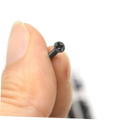Close-up of round head screw from Miniature Screw Set Kit For DIY Repairs And Pros, highlighting carbon steel material.