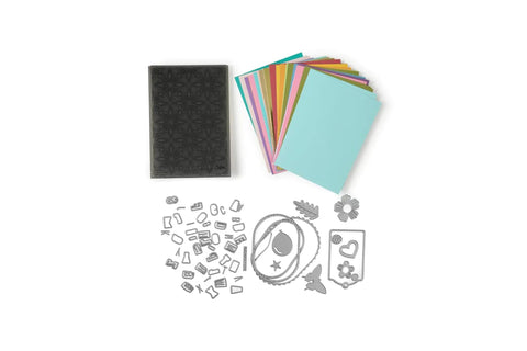 All In One 6 Inch Die Cutting And Embossing Machine Starter Kit with cutting dies, embossing folder, and cardstock.