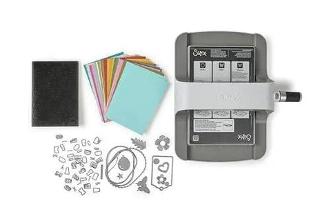 All In One 6 Inch Die Cutting And Embossing Machine Starter Kit with dies, embossing folder, cardstock, and accessories, top view