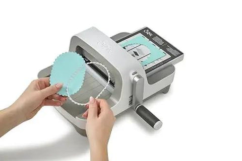 All In One 6 Inch Die Cutting And Embossing Machine Starter Kit with cutting dies shown in use, compatible with Sizzix Big Shot