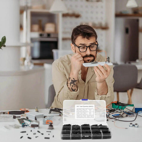 600Pcs M3 Nylon Hex Spacer Standoffs And Screws Assortment Kit used for PCB mounting with man working on electronics