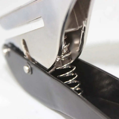 Close-up of Ergonomic Handheld 1 Hole Paper Punch 8mm Diameter Full Metal Puncher spring mechanism.