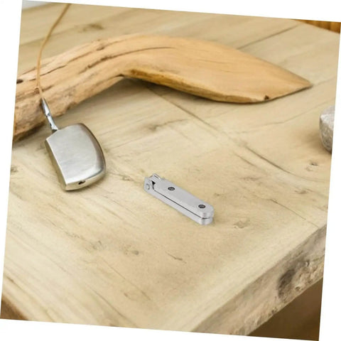 12 Pack Zinc Alloy 90 Degree Folding Hinges For Jewelry Boxes And Small Cabinets, shown on a wooden surface