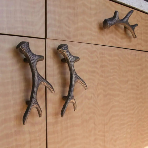 Antique Bronze Finish Cast Iron Deer Antler Drawer Pulls Set Of Six For Cabinets installed on wooden cabinet doors