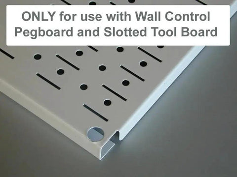 Close-up of a white slotted tool board for pegboard organization, with text highlighting compatibility with slotted tool boards.