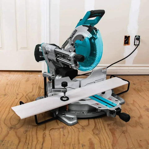 10 Inch Dual Bevel Sliding Compound Miter Saw With Laser For Accurate Cuts, Makita LS1019L, shown on a wooden floor, side view