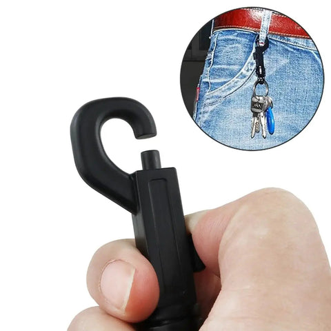 Hand holding Eight Pack Plastic Clasp Swivel Snap Keychain Clips With 360 Degree Rotation, shown attached to jeans with keys.