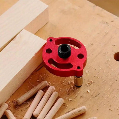 Red Self Centering Doweling Jig And Drill Guide For Precise 3 To 10 Mm Holes Portable Handheld Woodworking Locator on wood surface