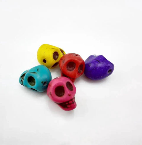 Pack Of 50 Mixed Color Turquoise Skull Head Spacer Beads For DIY Jewelry Making And Crafting, assorted colors, close-up view.