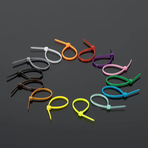 Colorful Zip Ties 1400 Pack 4 Inch Multicolor Plastic Wire Ties Assortment arranged on a dark surface