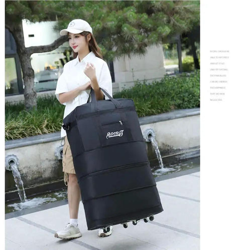 Woman holding Expandable Extra Large Travel Duffel Bag With Six Wheel Spinner, Waterproof Oxford Fabric, Lightweight for travel.