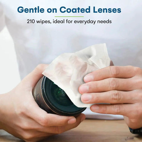 Person using Individually Wrapped Lens Wipes 210 Count Glasses Sunglasses And Camera Lenses to clean camera lens.