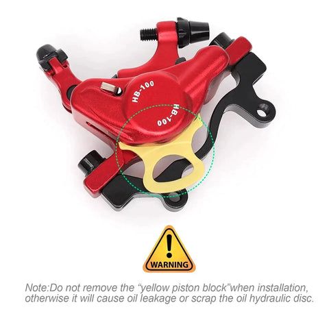 HB-100 MTB hydraulic disc brake caliper, red with yellow pad spacer (front view)