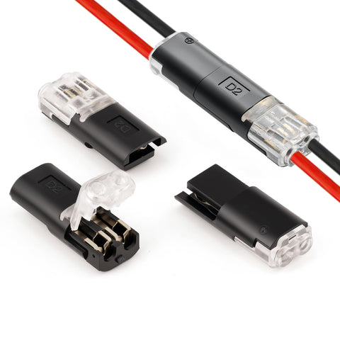 Four two-pin low-voltage quick-splice wire connectors with black housings and transparent ends