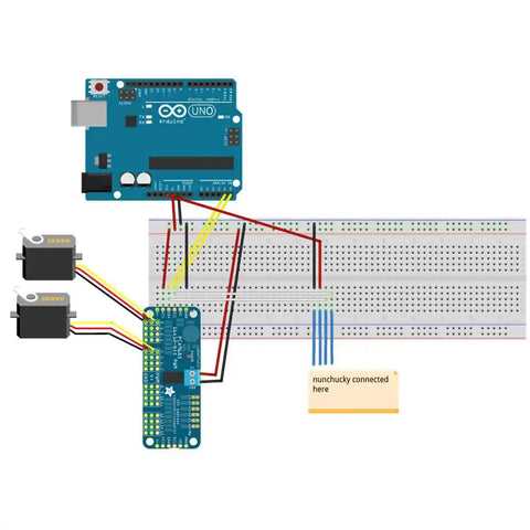 PCA9685 16 Channel 12-Bit PWM Servo Driver I2C Module wired for Arduino robots with servos, shown on a breadboard setup.