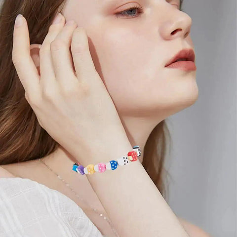Woman wearing bracelet made with Polymer Clay Mushroom Beads Kit With 400 Mixed Color Beads, handmade mushroom shapes.