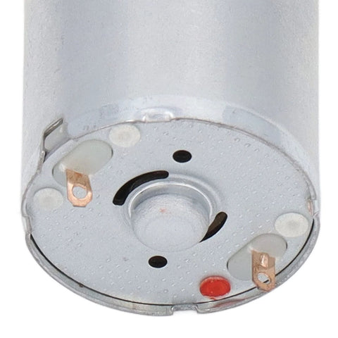 Round aluminum vacuum pump base with two copper terminals and red indicator LED.