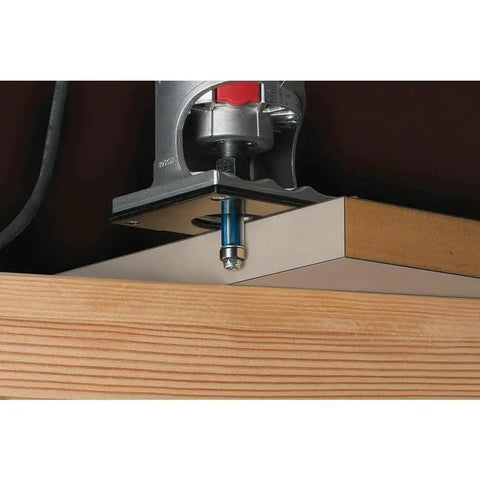 Heavy Duty One Quarter Inch By Three Quarter Inch High Speed Steel Single Flute Pilot Panel Straight Router Bit For Window And Door Cutouts In Abrasive Insulation Materials Plywood And Paneling With Drill Through Pilot installed in a router