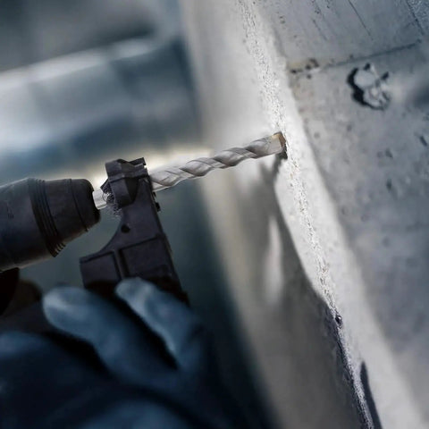 Heavy Duty Pro Grade SDS Plus Rotary Hammer Bit Set For Concrete And Masonry With Carbide Tips in use on a concrete wall
