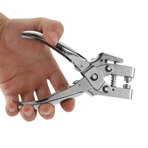 Hand holding DIY Eyelet Setting Tool Pliers Kit With 100 Gold Grommets, showcasing ergonomic grip and chrome finish for crafts.