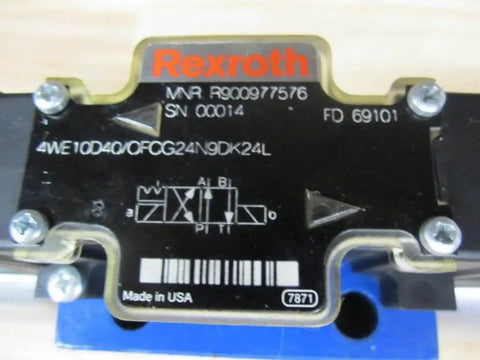 Close-up of the Hydraulic Solenoid Directional Control Valve 4WE10D40/OFCG24N9DK24L, PN R900977576, showing identification details.